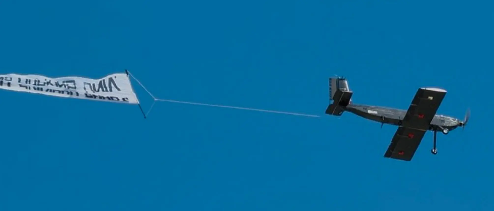 Banner deployed and flying behind the aircraft