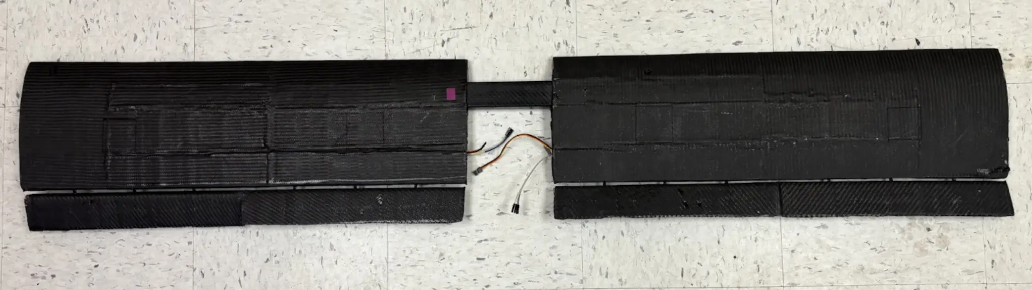Central carbon fiber wing spar fixed inside the fuselage